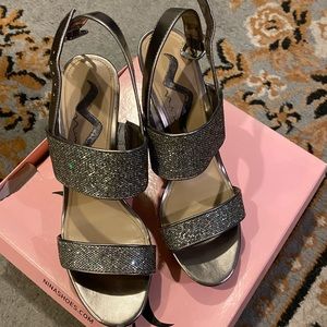 Silver high sandals.